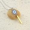 Memoir  Bass Gold bar evil eye pendant